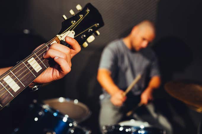 Guitarist and drummer performing on their Rockstar Band  Experience Gift day.